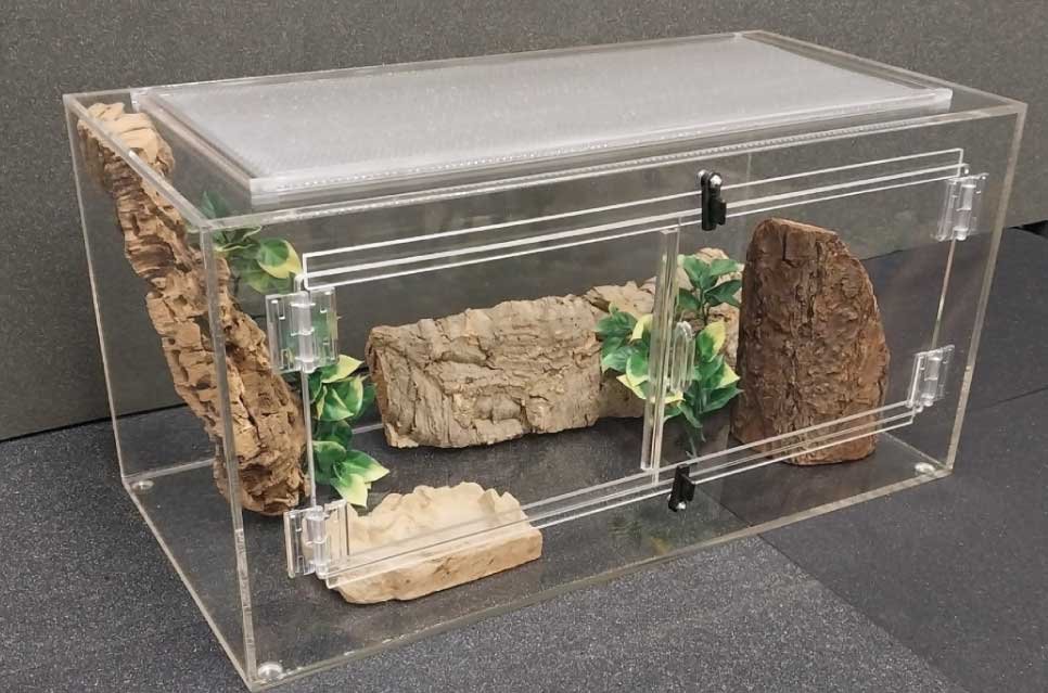 24 X 12 X 12" HIGH x 1/4 Acrylic Tank-Approx 15 gallons. Heating lamps can be placed on the 20" x 9" - 20 Gauge Aluminum Perforated Top. Their are two 7.38" x 9.38" side opening doors.